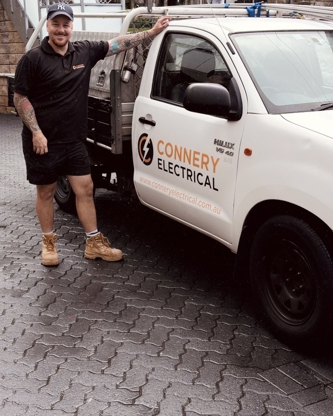 Oscar Connery, licensed electrician, beside the Connery Electrical ute on a Northern Beaches job